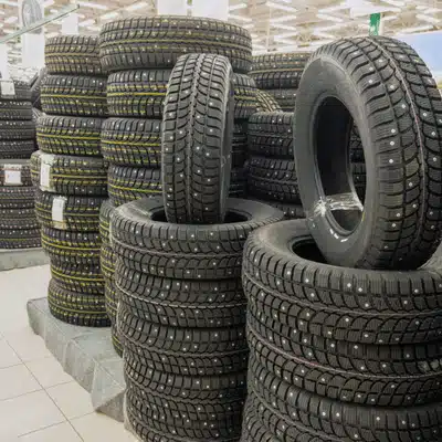 Stacks of new tires are arranged for quick pickup at tire shops in Waco